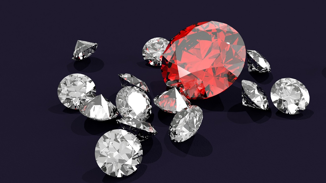 A ruby surrounded by loose white diamonds